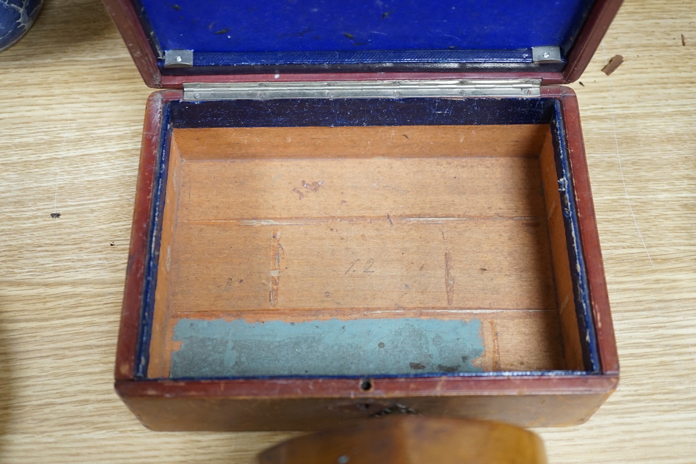 A 19th century mahogany tea caddy, writing slope, leather box and mantel clock, largest 30cm wide